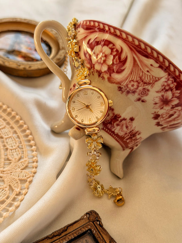 Sarı çiçek detaylı gold kadın saat vintage seramik üzerinde